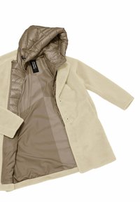 Beige fleece coat with a quilted brown inner lining and a hood. Two front snap closures and long sleeves, featuring a smooth finish.