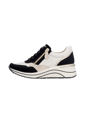 White and black wedge sneaker with black laces, side zipper, beige accents, and a grooved rubber sole for added traction.