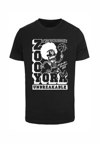 Black cotton t-shirt featuring a white graphic of a cartoon skeleton holding a basketball, with "ZOO YORK UNBREAKABLE" text and design elements.
