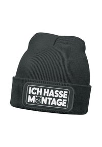 Black knitted beanie with ribbed texture, featuring a rectangular patch that reads "ICH HASSE MONTAGE" and a cat graphic in the center.
