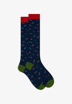 Calze blu navy con risvolto rosso e tallone verde, caratterizzate da un motivo di triangoli colorati, occhi e pianeti in vari colori. Materiale in misto cotone.