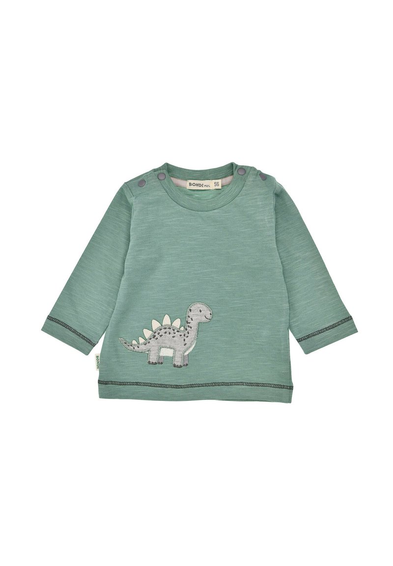 Maglietta verde a maniche lunghe realizzata in un tessuto morbido, con applicazione di un dinosauro grigio e cuciture a contrasto lungo il fondo e le maniche.