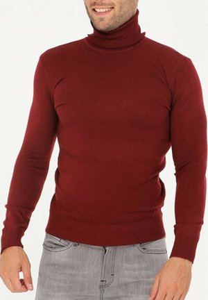Pull à col roulé bordeaux au design ajusté, fabriqué en tissu tricot doux. Doté de manches longues et d'un col et d'un ourlet côtelés.