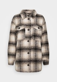 Giacca in misto lana con maniche lunghe e bottoni, con un motivo checkered nei colori beige, nero e bianco, e due tasche sul petto con patta.