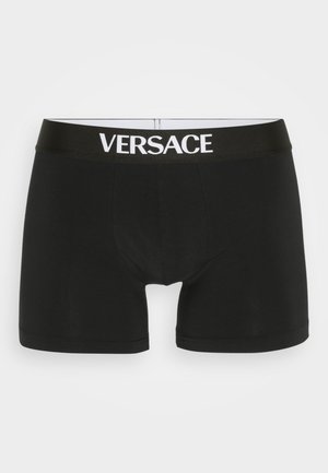 Boxer shorts noirs à coupe ajustée, fabriqués en coton, avec une large ceinture noire ornée du logo blanc "VERSACE".
