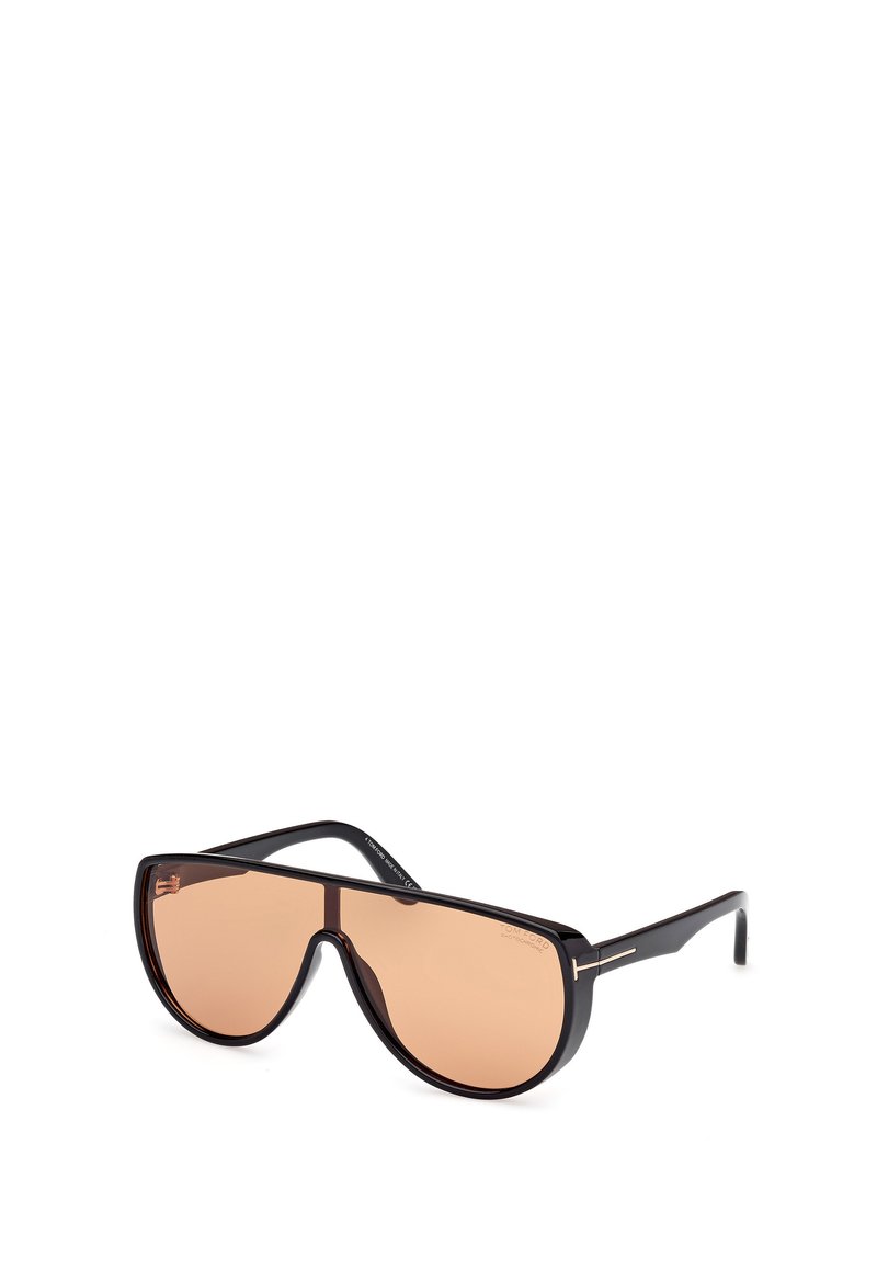 Černé oversized sluneční brýle s elegantním designem, které mají zbarvené hnědé skla a minimální kovové detaily na stranicích.