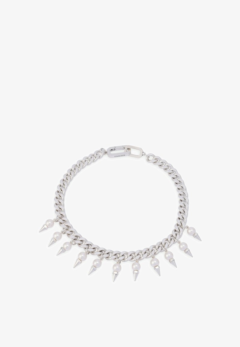 Bracelet en chaîne argentée avec des pointes et des perles alternées, doté d'un fermoir sécurisé et d'une finition polie.