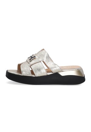 Silver metallic slide sandal with black sole, featuring open straps and a decorative silver accent. Smooth texture and low-profile design.