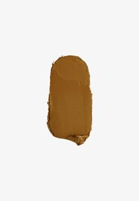 Lésion de couleur crème brunâtre ou de peinture avec une texture lisse, de forme ovale, et une couleur riche et chaude sur un fond blanc.