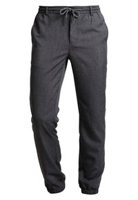 Pantaloni jogger grigio scuro realizzati in un tessuto testurizzato, dotati di una vita elastica con coulisse e polsini elastici alle caviglie.