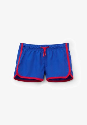 Bañadores de hombre en tejido azul brillante con acentos rojos, cuentan con una cintura elástica y cordón, y dobladillos laterales redondeados.