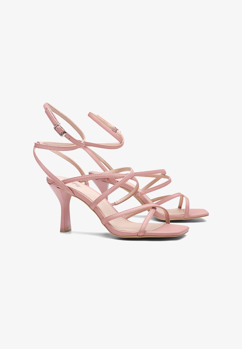 Zapatos de tacón rosas con un diseño elegante, que presentan una punta afilada, correas delgadas y un tacón cónico de 7,5 cm. Material de cuero suave.