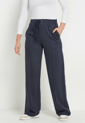 Navyblaue, leichte Sweatpants mit elastischem Bund und Kordelzug. Mit Seitentaschen und lockerer Passform, aus einem weichen, glatten Material gefertigt.