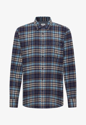 Flanelläriga särk, millel on ruuduline muster tumesinises, helesinises, pruunis ja kreemis. Pikad varrukad, nööpidega esiosa ja klassikaline kaelusdisain.