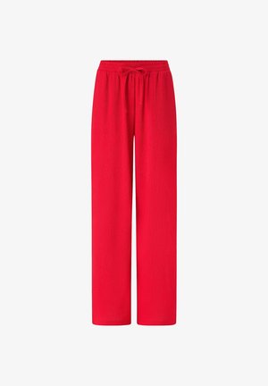 Czerwone spodnie o szerokich nogawkach z elastycznym pasem i wiązaniem z przodu, wykonane z lekkiej, teksturowanej tkaniny.