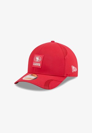 Red baseball cap with a rounded crown, a flat visor, and mesh accents. Features a square logo patch with "SF" and "San Francisco 49ers."