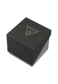 Boîte rectangulaire noire texturée avec une base grise, présentant un logo triangulaire argenté en relief sur le couvercle.