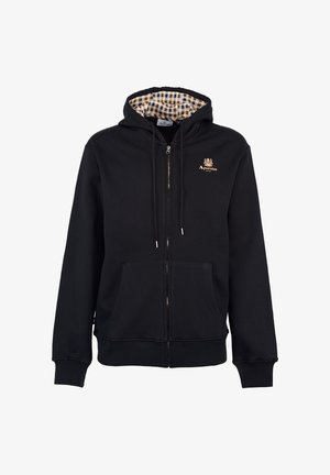 Felpa nera con zip, foderata con un motivo a quadri, tasche frontali, cordini e un piccolo logo oro sul lato sinistro del petto.