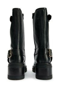 Black leather ankle boots featuring a chunky heel, side zippers, and buckle accents on the straps. Textured finish with a polished appearance.