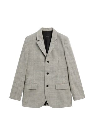 Blazer structuré en tissu à motif pied-de-poule noir et blanc, doté d'une fermeture à deux boutons et de deux poches avant.