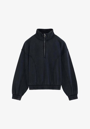 Sudadera negra de manga larga con cuello alto, cierre frontal con cremallera, puños y dobladillo elásticos, mostrada extendida sobre un fondo blanco.