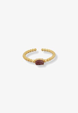 Gold ring featuring a beaded design, centered with an oval pinkish-purple gemstone. The band is adjustable for fit.
