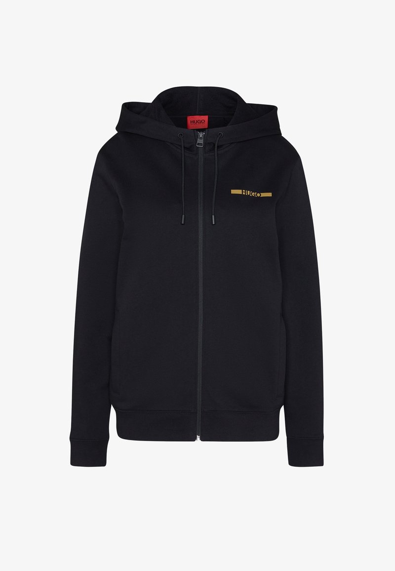 Sweat à capuche noir zippé avec cordons, avec un petit logo doré "HUGO" sur la poitrine gauche et une étiquette intérieure rouge au col.