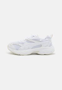 White running shoes featuring a mesh upper, curved rubber sole, and subtle design lines. Includes a tab at the heel for easy wear.
