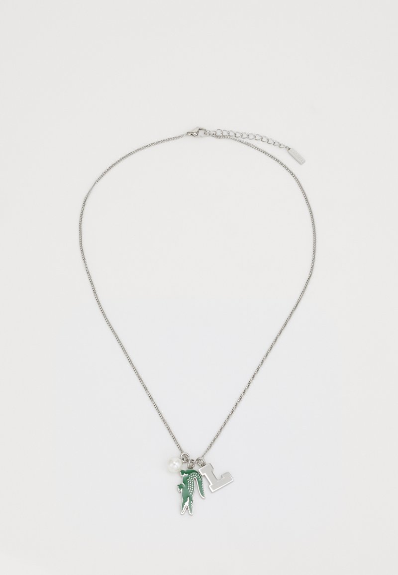 Silver chain necklace featuring green charms, a pearl accent, and a metal "L" pendant. Textured design with varying shapes and colors.