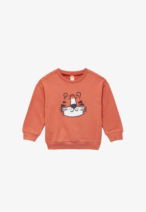 Oranssi huppari, joka on valmistettu pehmeästä materiaalista ja jossa on tiikerin kasvokuvio. Siinä on pyöreä kaula-aukko ja pitkät hihat, joissa on resorit hihansuissa ja helmassa.