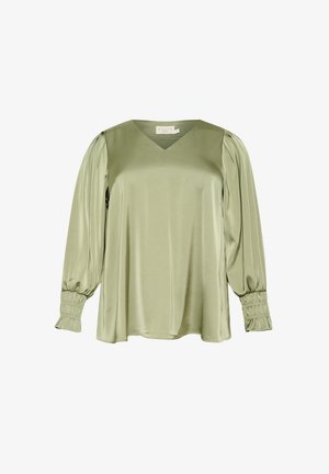 Blouse à manches longues et col en V, fabriquée en tissu léger et lisse de couleur verte. Elle présente des manches froncées et tombe doucement pour un ajustement décontracté.