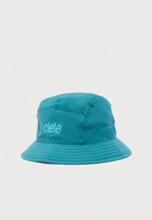 Türkisfarbener Fischerhut mit abgestepptem Rand und "ciele ATHLETICS"-Logo auf der Vorderseite, vor einem schlichten weißen Hintergrund präsentiert.