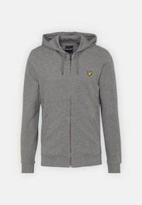 Šedá mikina na zip vyrobená z měkkého materiálu, s kapucí, předními kapsami, ribbenovými manžetami a malým žlutým logem na levé hrudi.