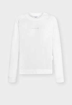 Λευκό φούτερ με μακριά μανίκια από απαλό ύφασμα, με στρογγυλή λαιμόκοψη και μανίκια ράγκλαν. Διαθέτει διακριτικό λογότυπο τυπωμένο στο μπροστινό μέρος.