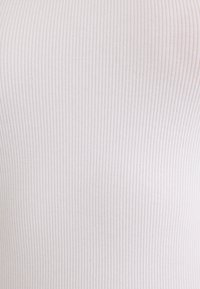 White ribbed fabric, lightweight with vertical stripes and a soft texture. The close-up highlights the even pattern and slight sheen.