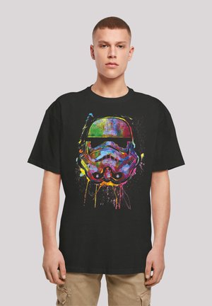 Black t-shirt featuring a colorful graphic of a stormtrooper helmet with splashes of various vibrant colors on the front.