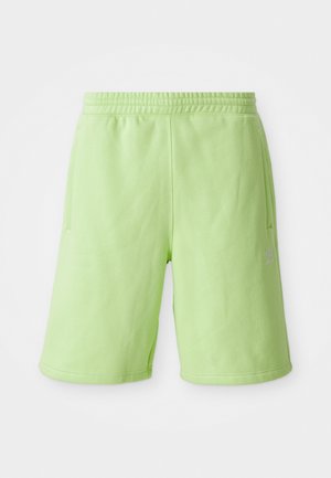 Limoengroene shorts van zachte stof, met een elastische tailleband,zijzakken en een klein wit logo aan de onderzijde rechts.
