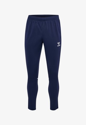 Pantalones deportivos azul marino ajustados con cintura elástica y logo blanco de hummel en el muslo derecho, diseñados para uso atlético.