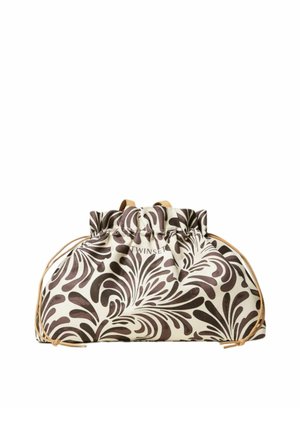 Sacchetto crema con coulisse con motivo a foglie nere a spirale e cordini beige, tessuto morbido con parte superiore arricciata.