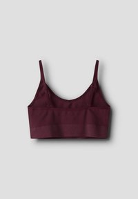 Bordeaux ribbet bralette med justerbare stropper og et bredt elastisk bånd. Stoffet er glat, hvilket giver et sømløst udseende og en behagelig pasform.