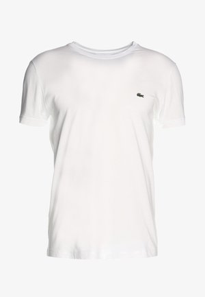 White short-sleeved t-shirt made of cotton, featuring a crew neckline and a small green embroidered logo on the left side.