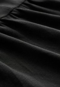 Next SLEEVLESS REGULAR FIT - Trikoomekko - black
