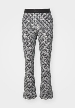 Ausgestellte Leggings im schwarz-weißen geometrischen Muster mit floralen Akzenten. Sie verfügen über einen schwarzen elastischen Bund für Komfort und perfekten Sitz.