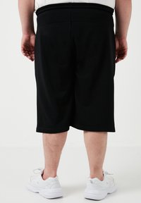 Buratti PLUS SIZE - Spodnji deli trenirk - black