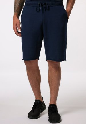 Shorts en coton bleu marine avec une taille élastique et un cordon de serrage, présentant un ourlet brut et des poches latérales. Convient pour une tenue décontractée.