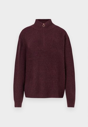 Burgunderfarbener Strickpullover mit hohem Kragen, ausgestattet mit einem halben Reißverschluss und einem runden Ziehband, geripptem Material und langen, enganliegenden Ärmeln.