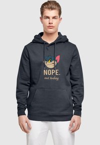 Marinefarbener Hoodie mit dem Gesicht einer Cartoonfigur und dem Text "NEIN. Nicht heute" in beige. Pullover-Stil mit einer Vordertasche und Kapuze mit Kordelzug.