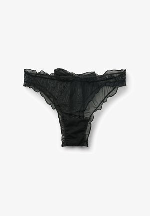 Czarny string z koronką, z falbankami na brzegach, przezroczystą fakturą oraz jednolitym czarnym bawełnianym panelem z tyłu. Lekki i delikatnie zaprojektowany.