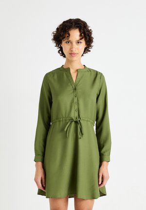 Green, long-sleeve dress made of smooth fabric, featuring a buttoned placket, a relaxed fit, and a waist tie for adjustment.