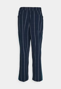 Navy blue trousers with vertical white stripes, elastic waistband, two side pockets, and a straight-leg design. Smooth texture.